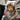 Young child shopping in a toy store holding a boxed toy helicopter, exploring fun gift options for kids.