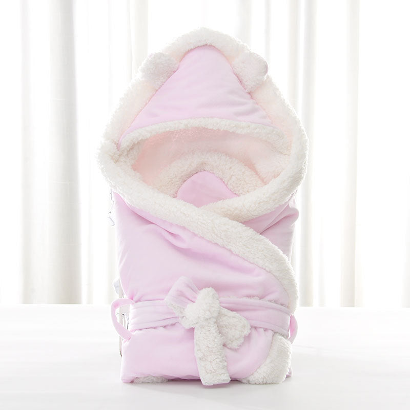 Newborn baby being hugged and swaddled by baby - Cindi Book
