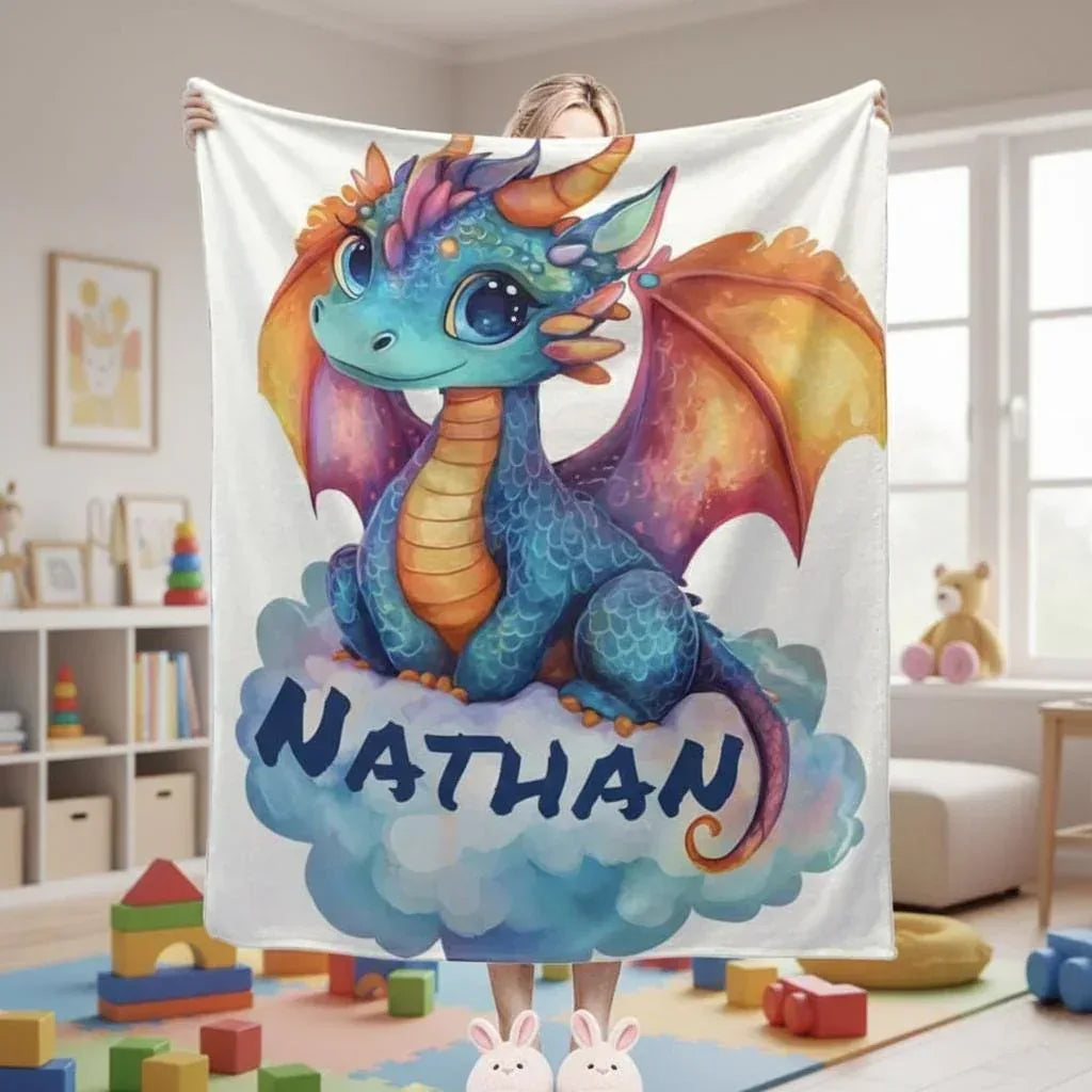 Personalized Dragon Blanket | Custom Name | Cute Baby Dragon Sitting on Cloud Orange Wings Teal Blue Big Eyes White Background Fleece Throw Gift
